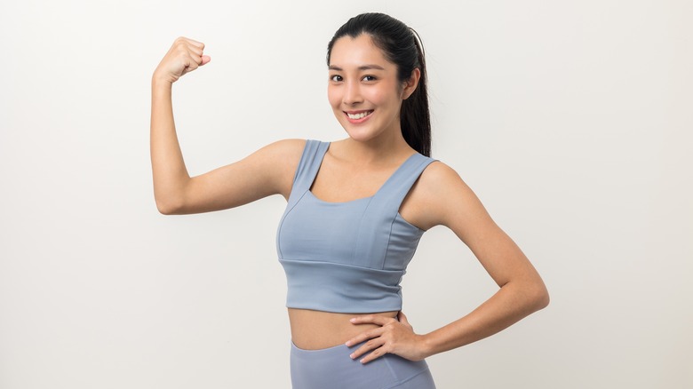 fitness woman flexing her arm