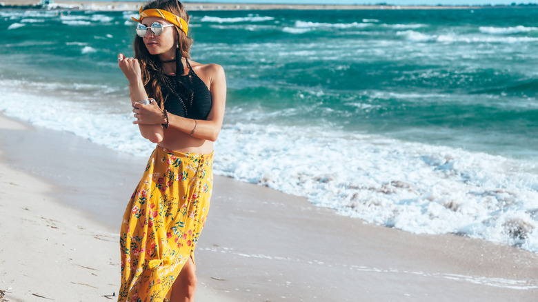 woman in maxi skirt on beach