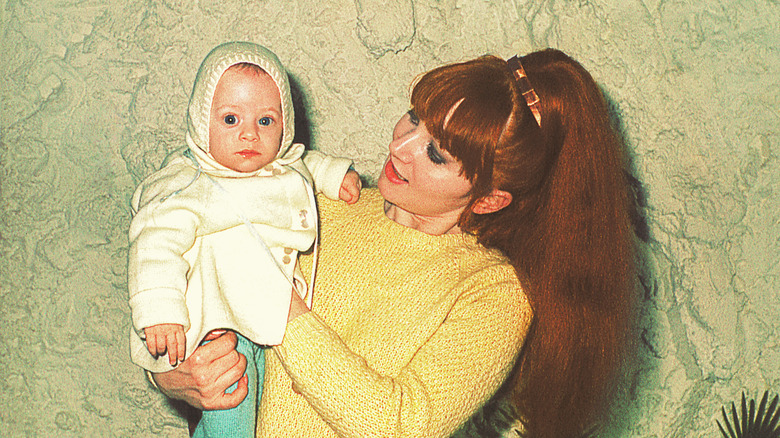 A vintage photo of a mother and her baby