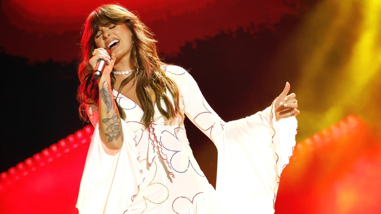 Ella Langley performs in a white dress at the CMA Fest in June 2026.