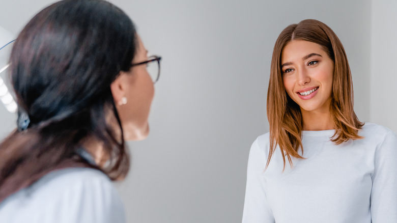 woman and female doctor talking