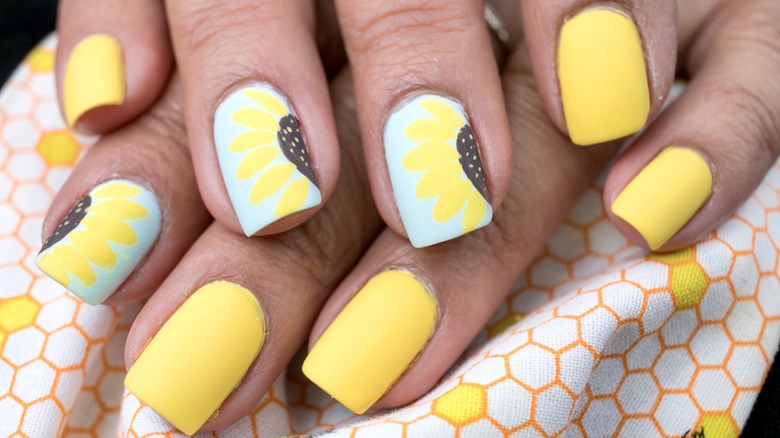 Woman with sunflower nails