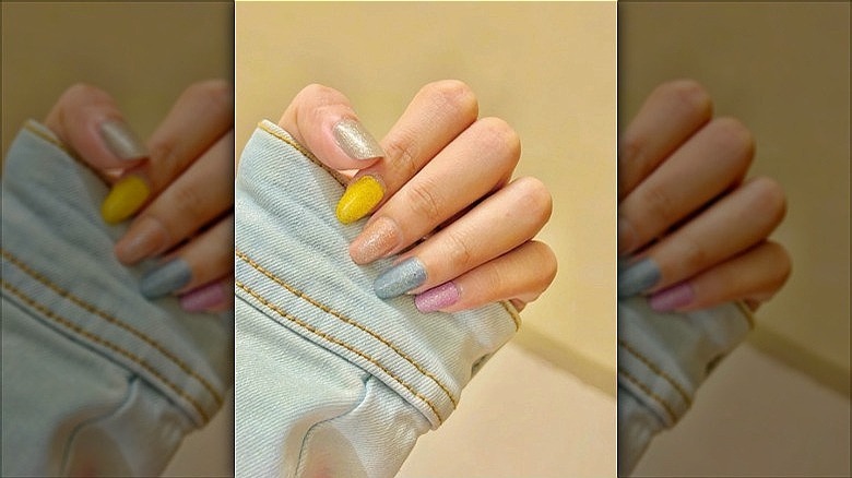 woman with pastel sparkly nails