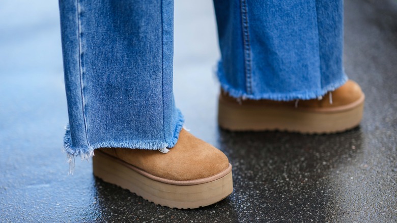 Closeup of jeans and Ugg boots