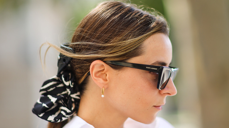 woman wearing scrunchie