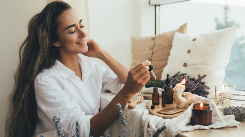 Woman using hair serum