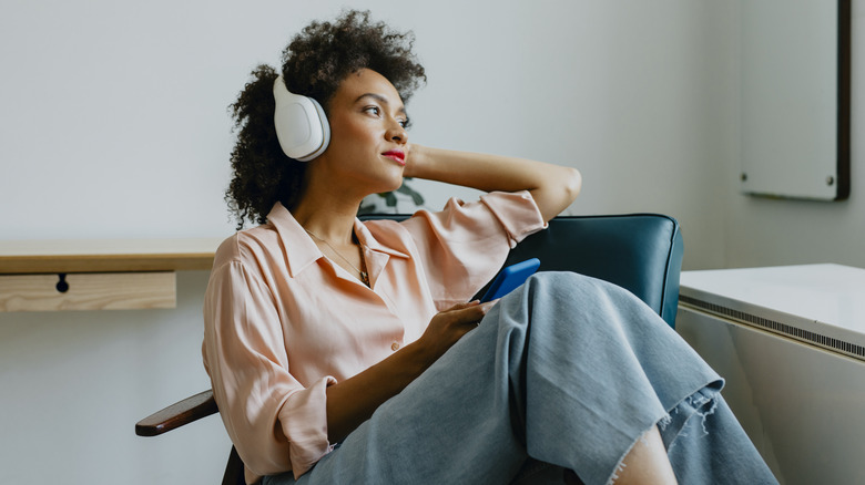 woman listening to headphones