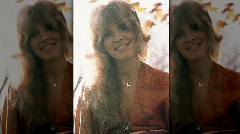 Stevie Nicks smiles for the camera in the 1970s