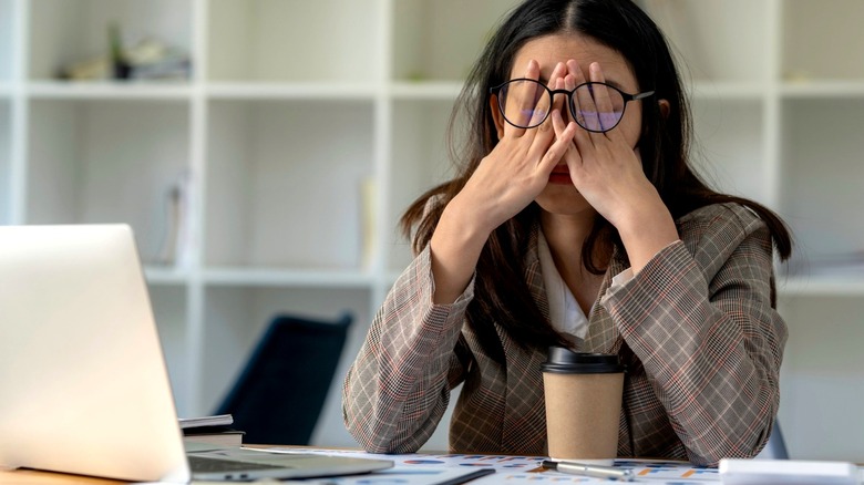 Tired woman at desk