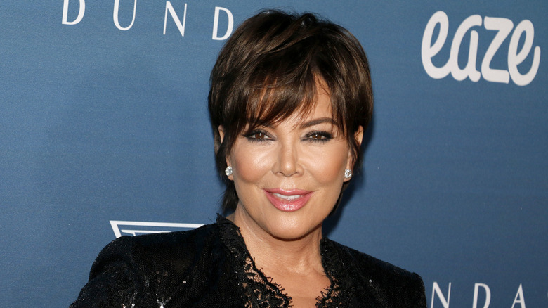 Kris Jenner smiles with a cropped haircut