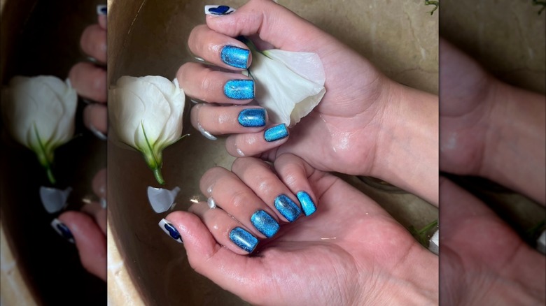 Blue chrome nails.