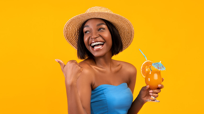 woman drinking a mocktail