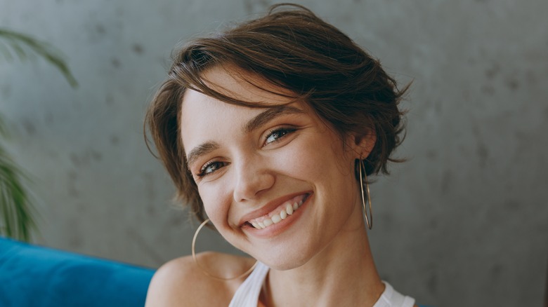 woman smiling taking selfie