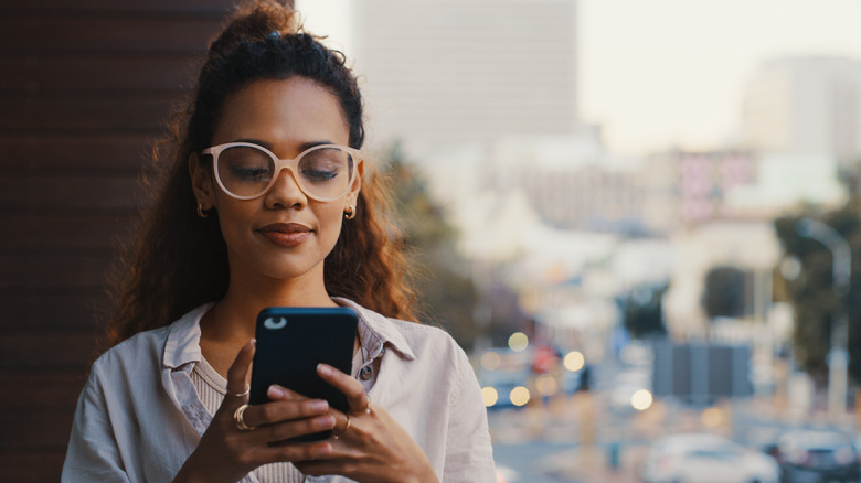 A woman texting on her smartphone