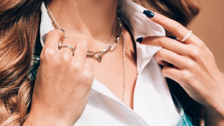 A woman wearing a paperclip necklace