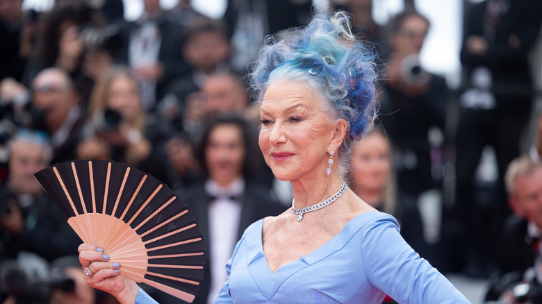 Helen Mirren poses with blue colored hair at Cannes in 2023