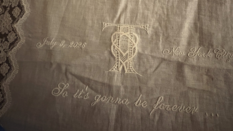 Embroidered handkerchief for Taylor and Travis wedding with details and lyrics on it