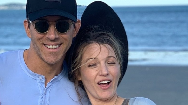 Selfie shot of Ryan Reynolds and Blake Lively with a funny face at the beach.