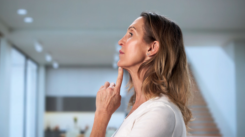 A woman lifting her head up