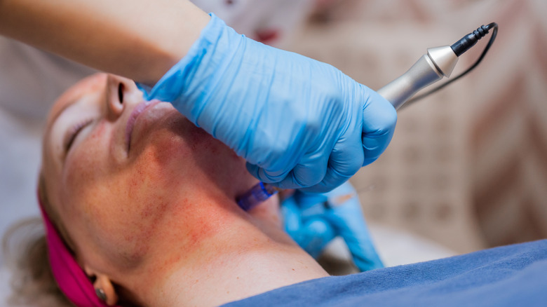 A woman getting a neck treatment