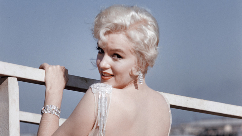 Marilyn Monroe looks over her shoulder at the camera