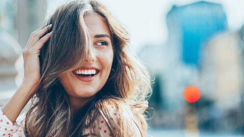 Woman with wavy hair smiling