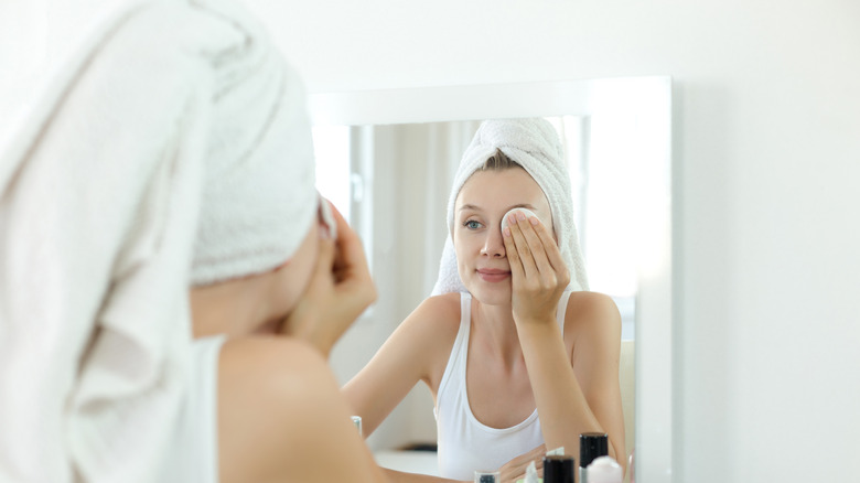 Woman with white towel on head