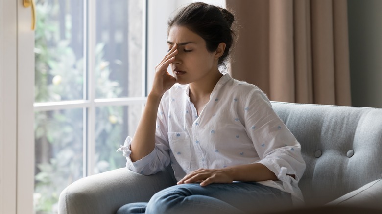 Frustrated woman with a headache