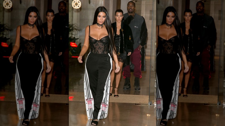 Kim Kardashian walking in Paris in a corset and track pants