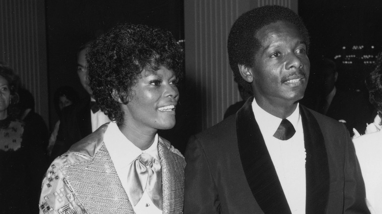 Black-and-white photo of Dionne Warwick walking with her husband, American actor William Elliott in 1972.