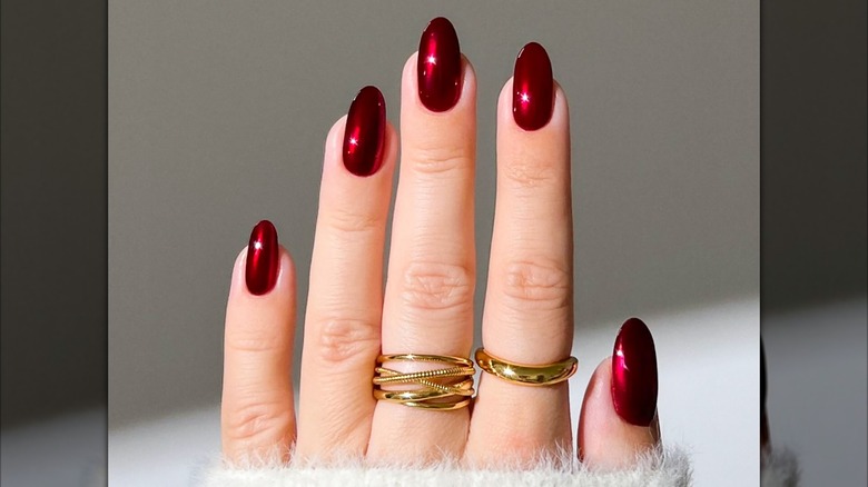 Shot of a burgundy chrome manicure.