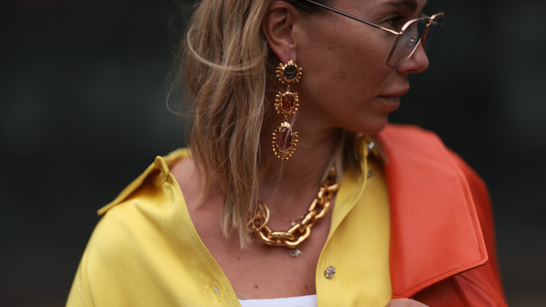 Woman wearing statement earrings