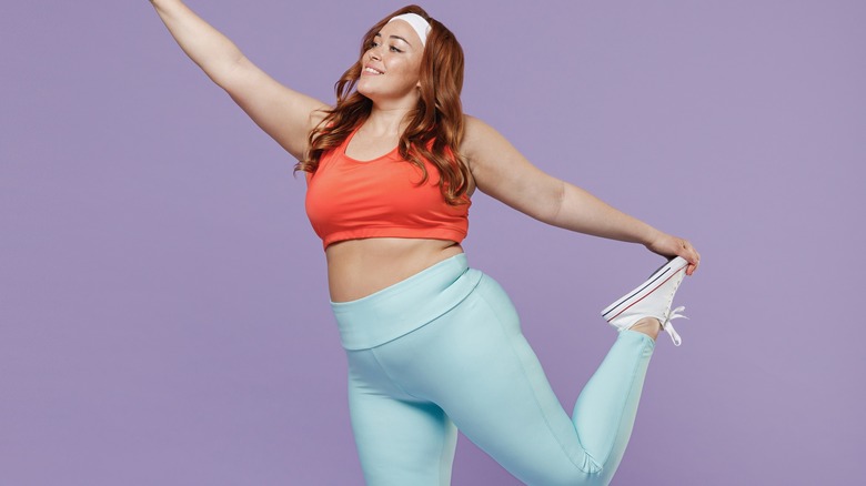 Woman exercising in leggings.