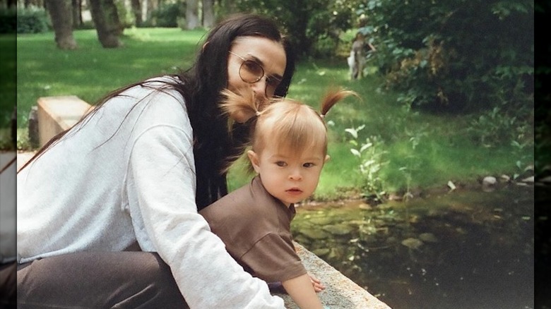 Demi Moore posing with her granddaughter Louetta