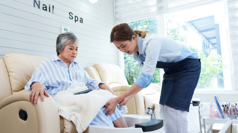 older woman getting a pedicure