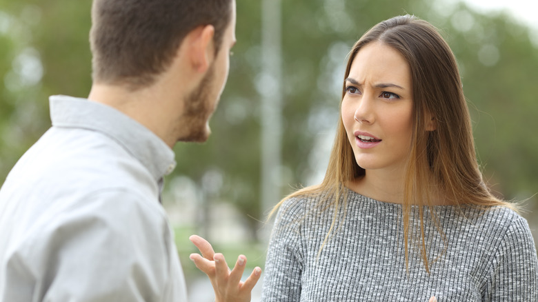 Unhappy couple sitting