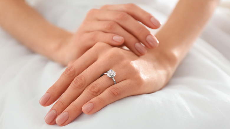 young bride wearing a circle engagement ring