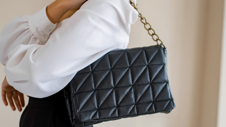 quilted black bag with gold chain