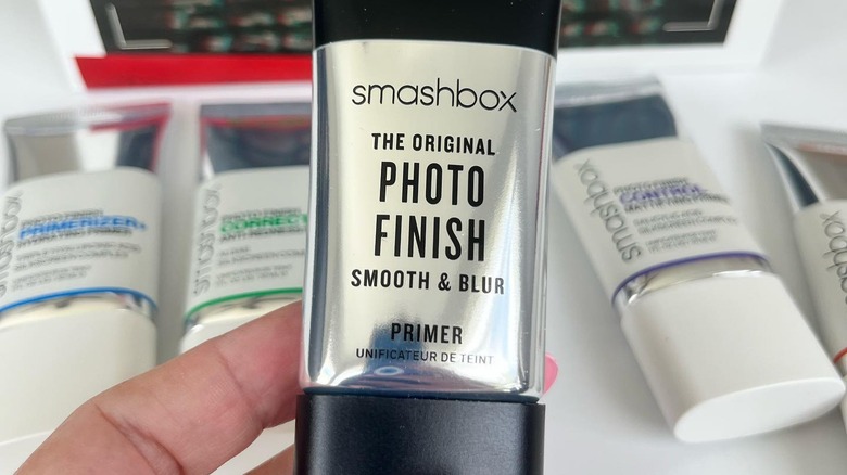 Woman holding Smashbox primer