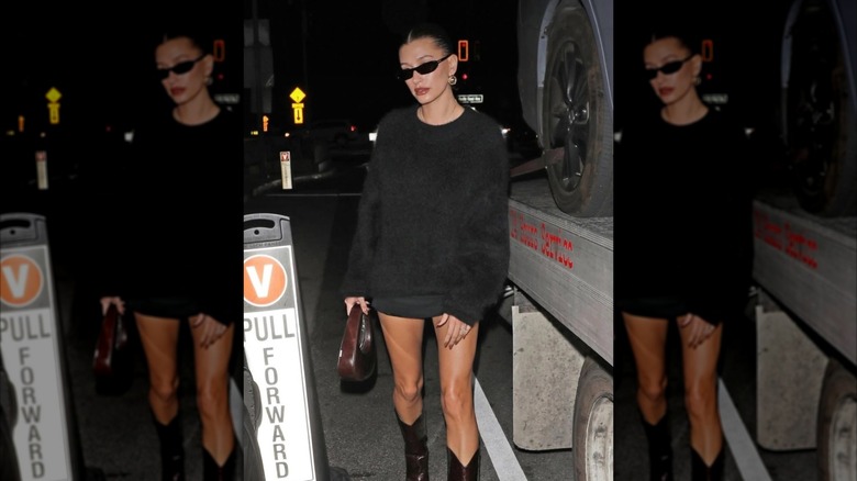 Hailey Bieber out wearing skinny sunglasses.