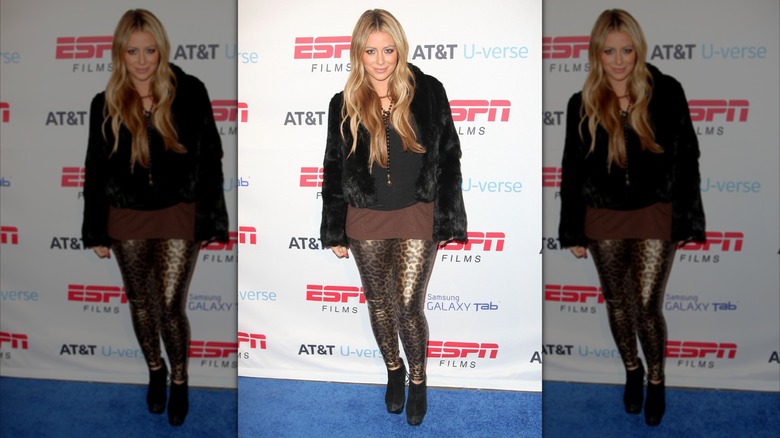 Aubrey O'Day at an event in 2011 wearing animal print leggings.