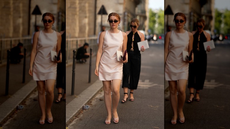 A woman in a blush satin minidress