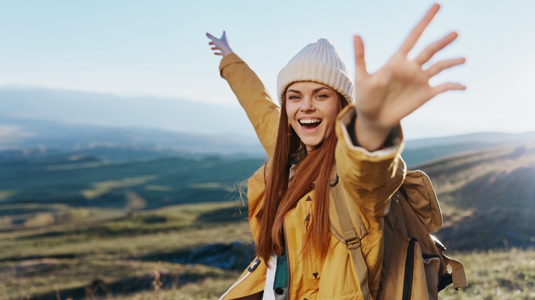 smiling girl traveling on mountain