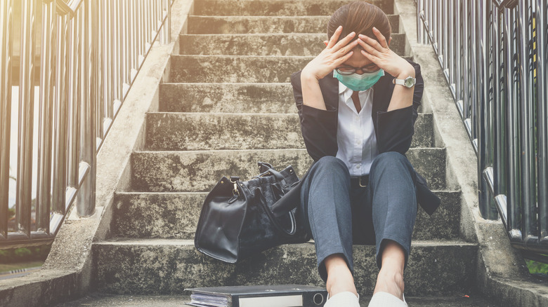 Woman upset on stairs