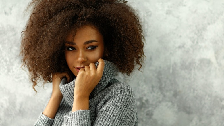 Black woman gray wool sweater