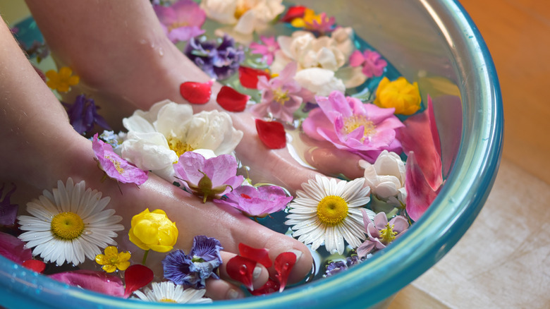 Soaking feet in flowers