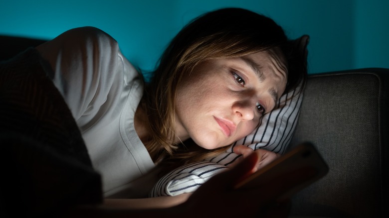 sad texting woman