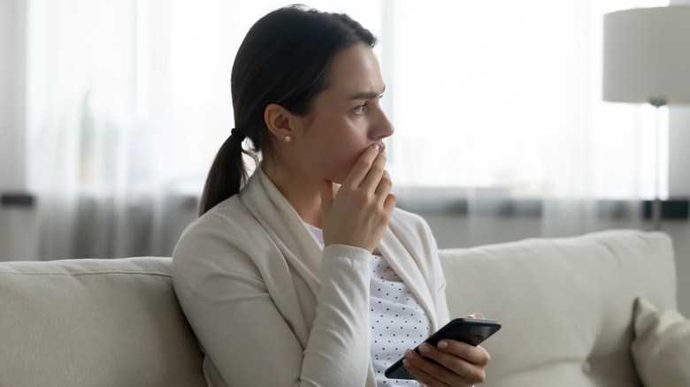 sad texting woman