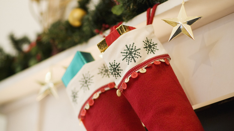 Christmas stuffed stockings on a fireplace