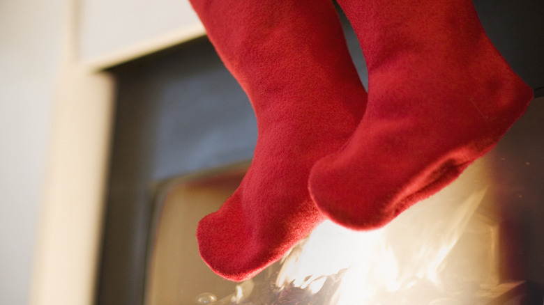 Christmas stuffed stockings on a fireplace